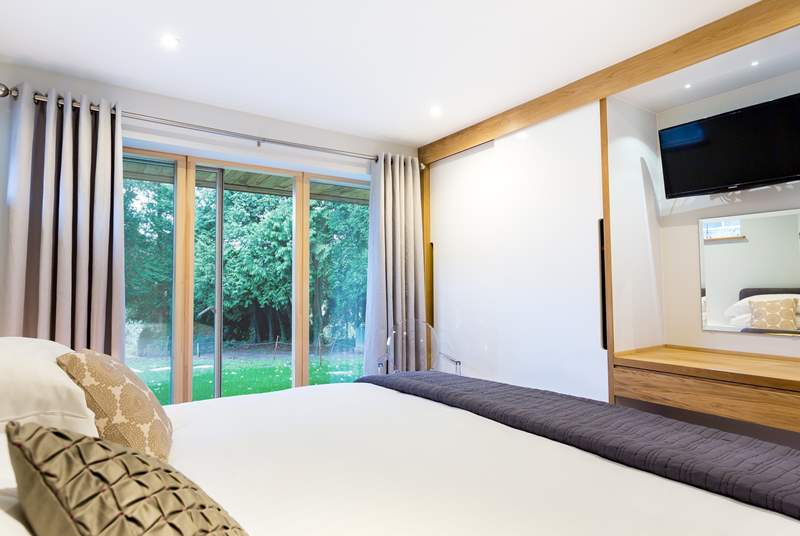 This is a ground floor bedroom, there is a pathway available to hotel guests to the right of the lawn area that leads to the private foreshore. 