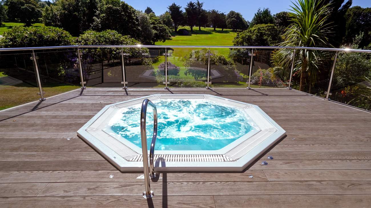 Enjoy a glass of champagne in the outside hot tub at the spa.
