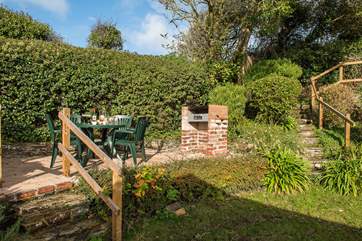 Enjoy meals al fresco on the lower decking-area.
