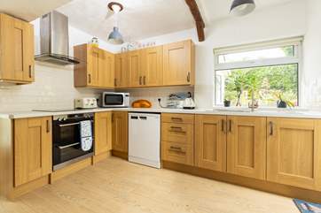 The lovely light kitchen overlooking the garden.
