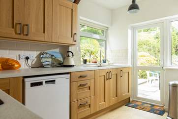 The kitchen door leads directly out to the little paved area of the garden.