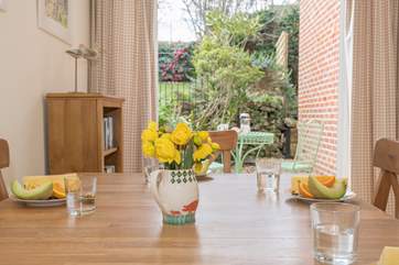The dining-room has a second set of patio doors that lead out to the very pretty patio and raised garden.