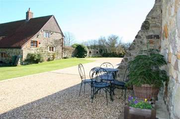 There is outside seating in front of the property before the parking area.