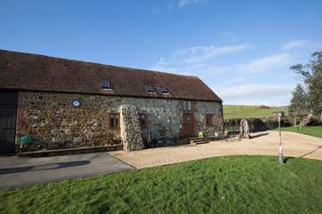 Through the large stable-door you will find a door to each of the two properties in the barn.