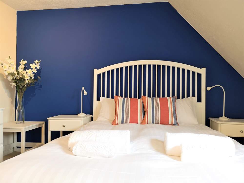 A comfy bedroom with double bed.