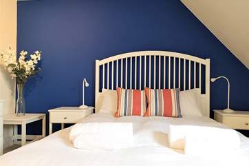 A comfy bedroom with double bed.