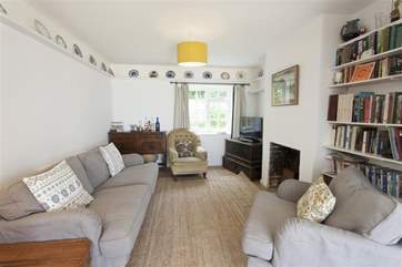 The comfortable sitting/dining-room, with views to the garden and the sea.