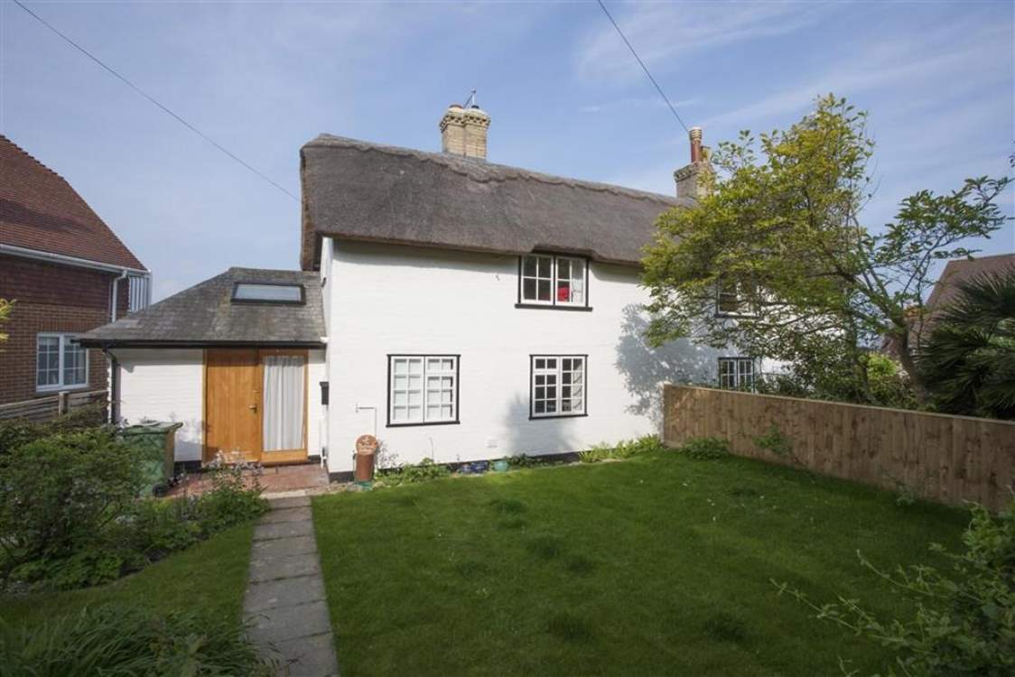 The fully enclosed front garden is a lovely spot for young children.