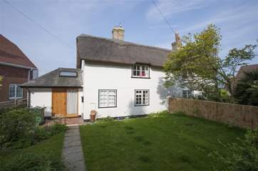 The fully enclosed front garden is a lovely spot for young children.
