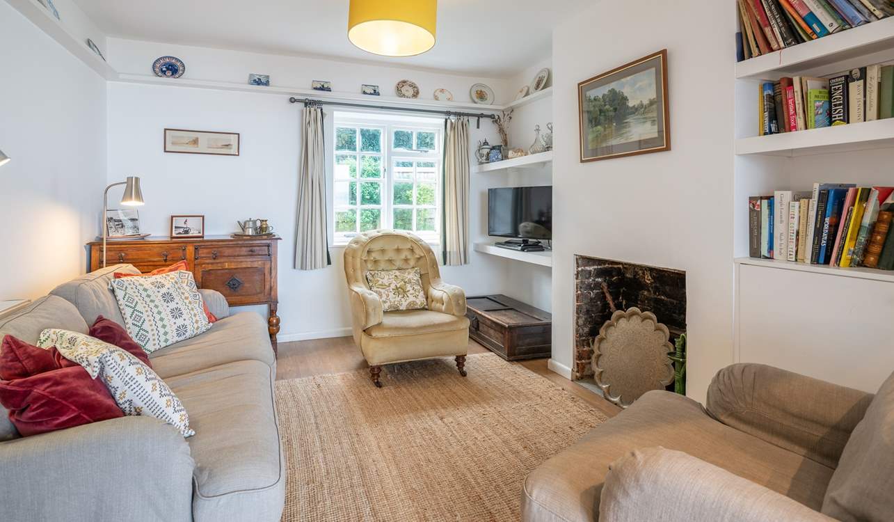 The comfortable sitting/dining-room, with views to the garden and the sea.