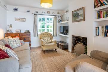 The comfortable sitting/dining-room, with views to the garden and the sea.