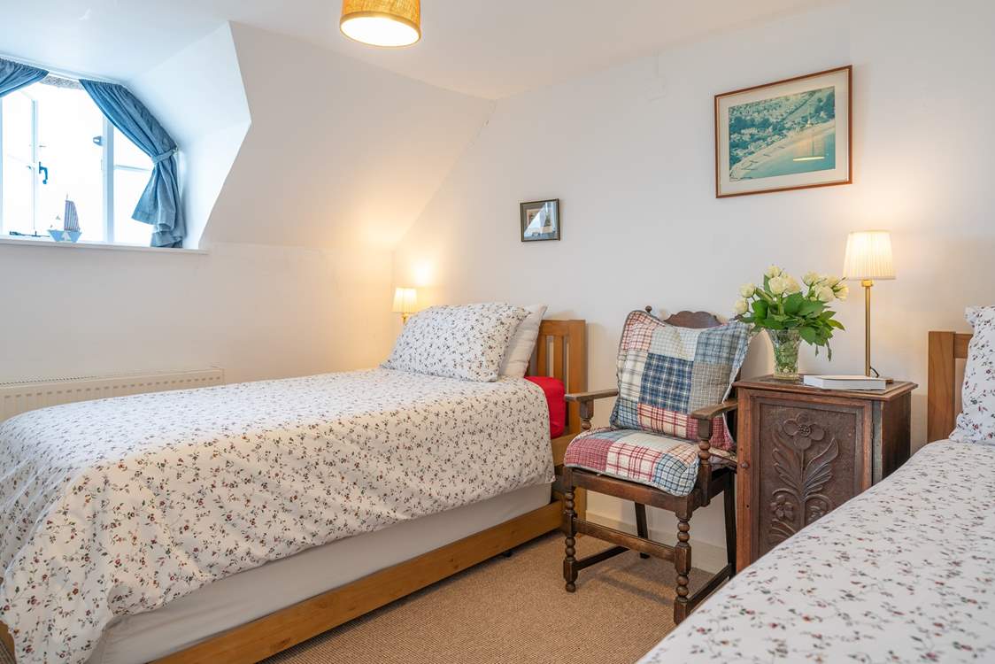 The twin bedroom has wonderful sea views from the window.