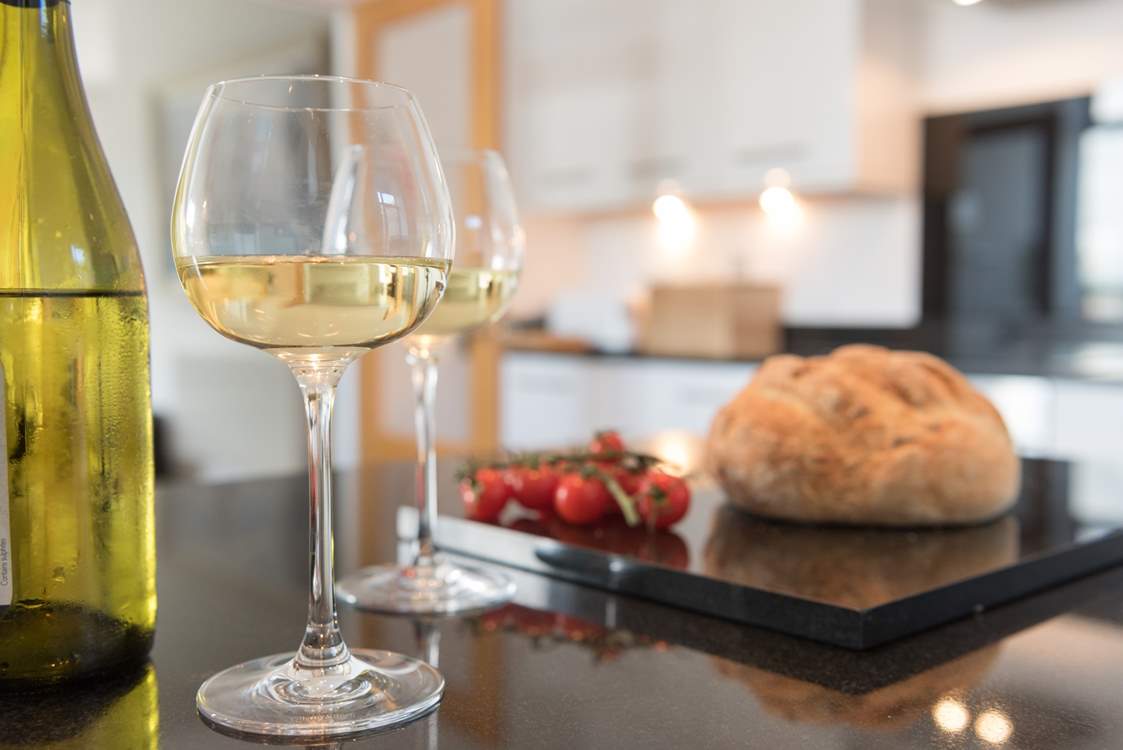 The modern kitchen has granite worktops.