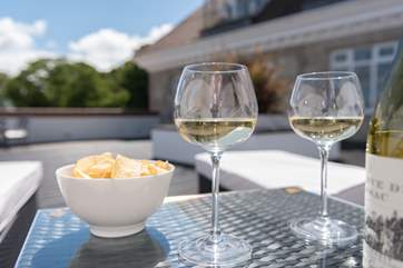 The large terrace has plenty of space for relaxing and dining.