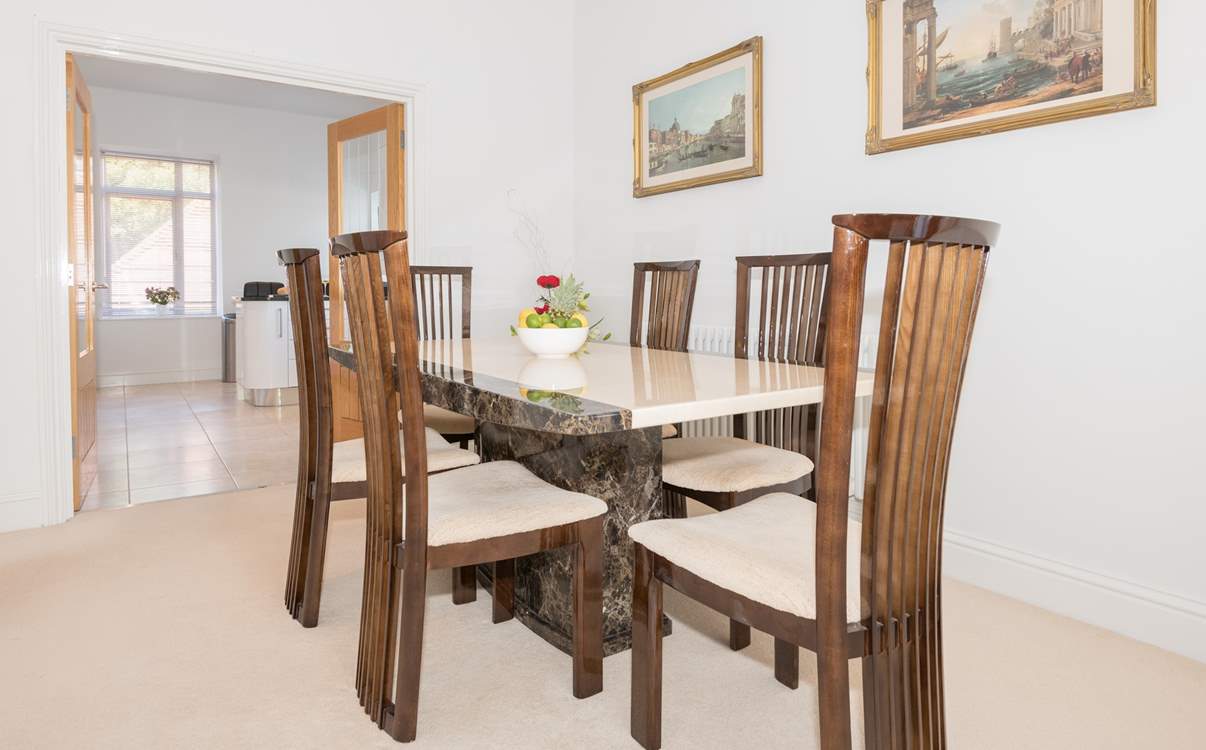 The dining-area and spacious kitchen beyond.