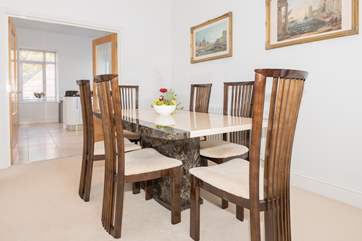 The dining-area and spacious kitchen beyond.