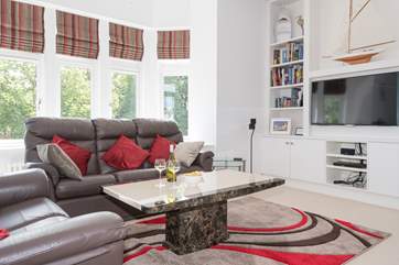 The bright and airy sitting-room.
