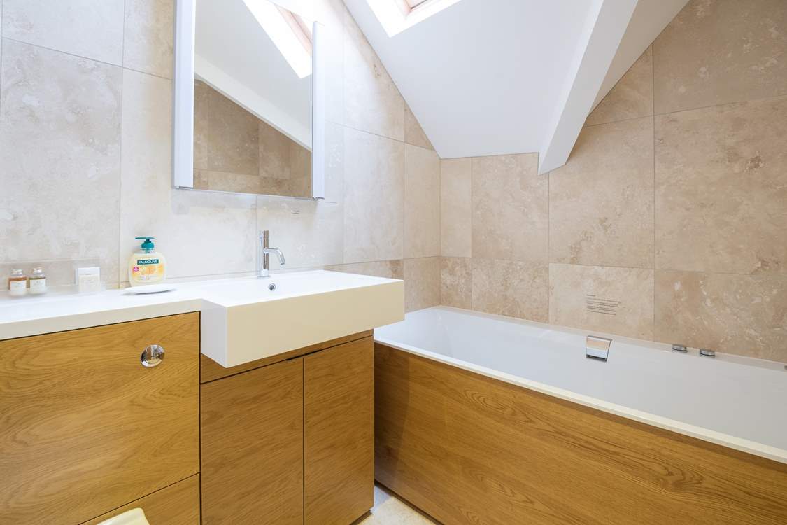 In addition to the two en suite shower-rooms there is a family bathroom.