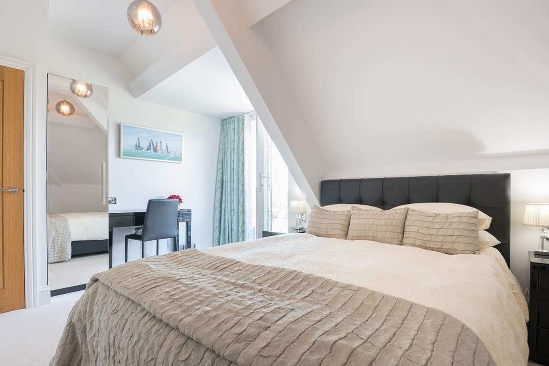 The second double bedroom also has an en suite shower-room and private balcony.