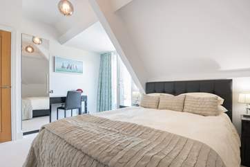 The second double bedroom also has an en suite shower-room and private balcony.