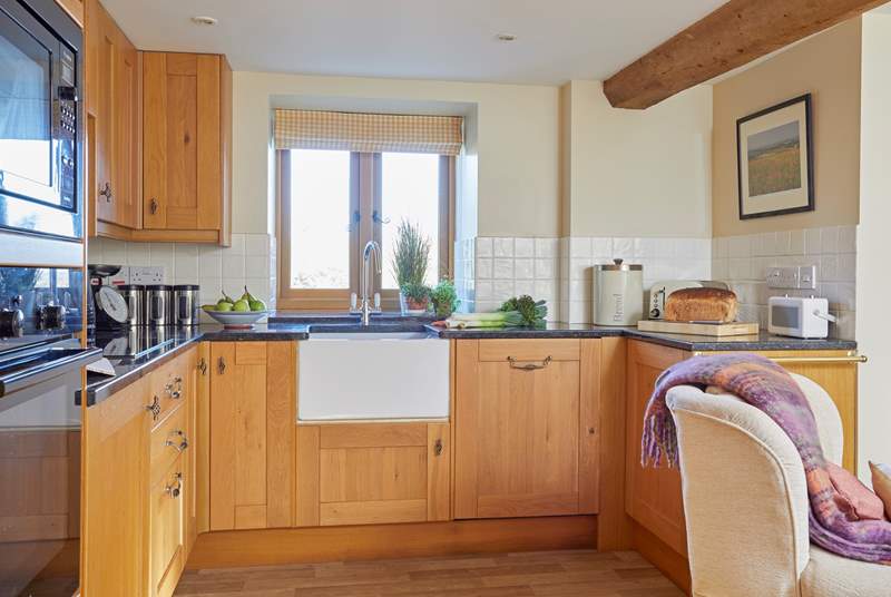 The open plan kitchen area is a perfect size for preparing any meal.