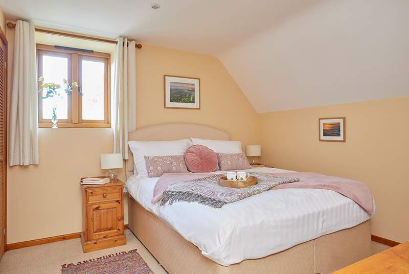 The bright and comfortable double main bedroom. 