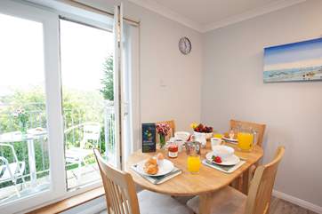Double doors lead out to a second balcony and allow light to flood into the kitchen area.