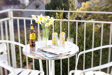 Enjoy a cool drink and the views from the balcony at 2 Bermuda.