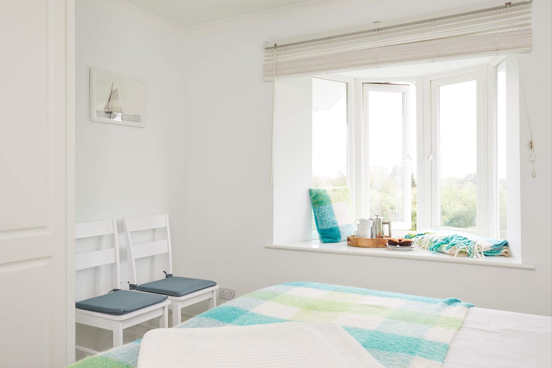 Bedroom one is a comfortable super-king room featuring a deep-ledged window to admire the lovely views. 