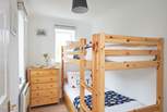 Bedroom two enjoys a dual aspect and bunk beds, which the children will love! 