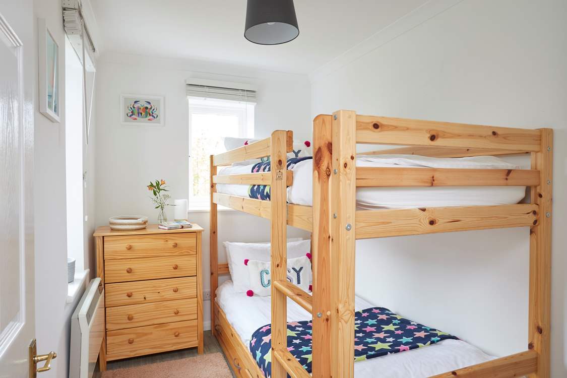 Bedroom two enjoys a dual-aspect and bunk-beds, which the children will love!