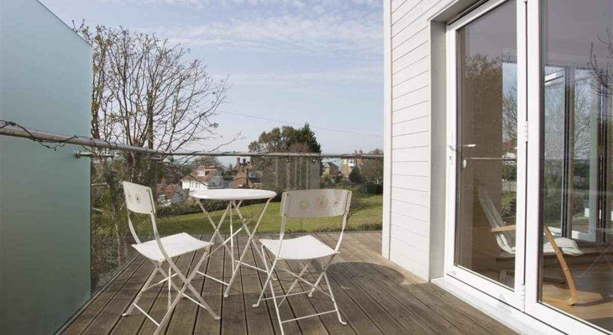 The sitting-room has a wrap-around balcony with a small table and chairs; the perfect place for a glass of vino whilst enjoying the views.