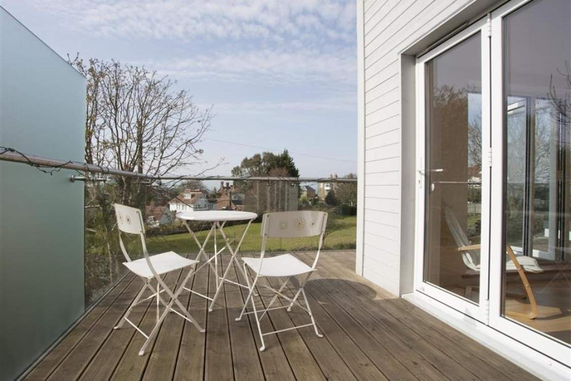 The sitting-room has a wrap-around balcony with a small table and chairs; the perfect place for a glass of vino whilst enjoying the views.