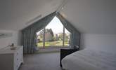 The main bedroom with views of the village and Solent beyond. - Thumbnail Image