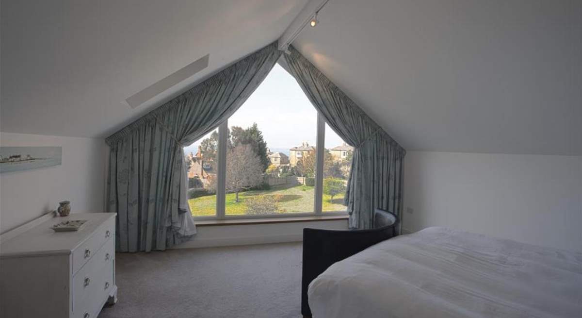 The main bedroom with views of the village and Solent beyond.