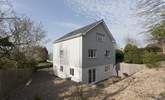 There is rear decking with garden furniture, enclosed by a raised shingle area (please note, the barbecue shown is no longer available for use). - Thumbnail Image