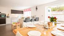 The beautiful kitchen/dining-room with doors opening onto the patio area.