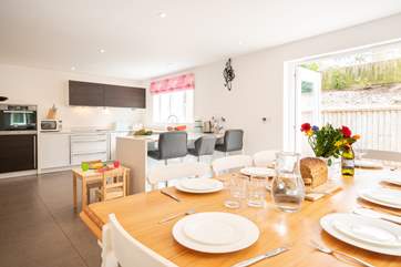 The beautiful kitchen/dining-room with doors opening onto the patio area.
