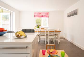 The kitchen-diner offers a sociable, open-plan space for family meal times. 