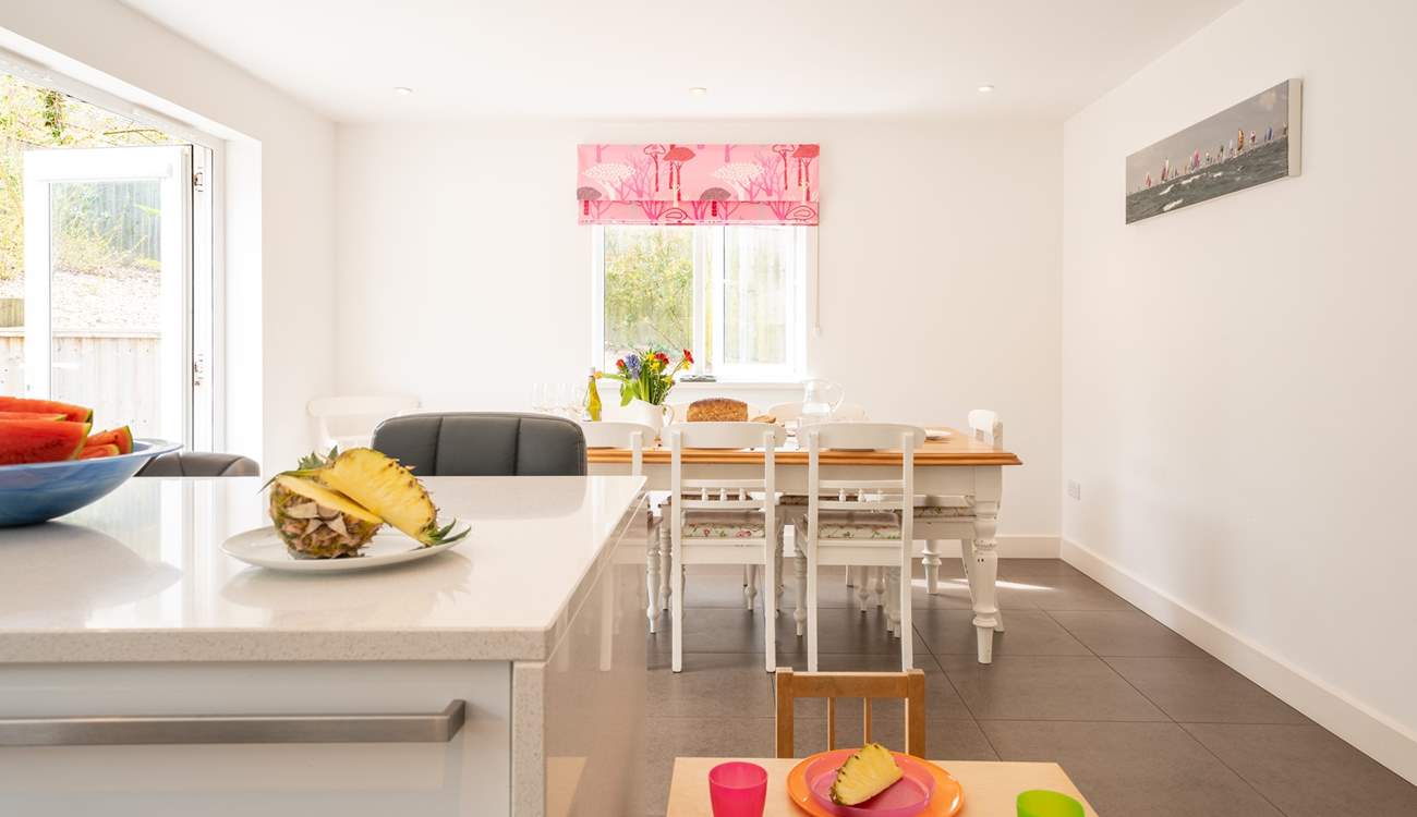 The kitchen-diner offers a sociable, open-plan space for family meal times. 