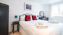 The bright and airy second bedroom on the first floor.