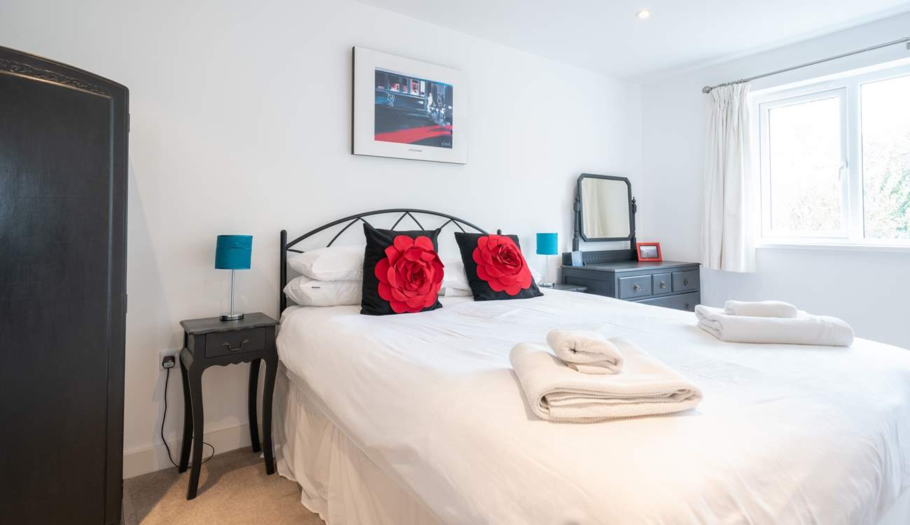 The bright and airy second bedroom on the first floor.