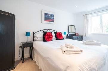 The bright and airy second bedroom on the first floor.