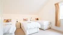 The fourth bedroom offers three single beds... 
