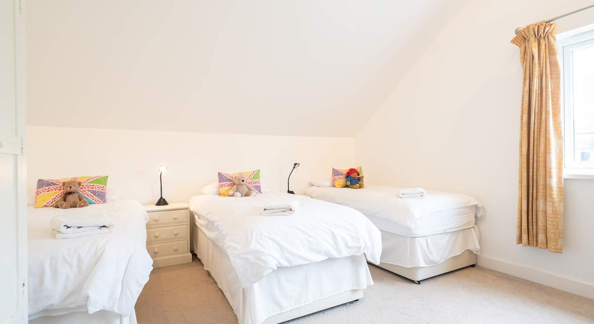 The fourth bedroom offers three single beds... 