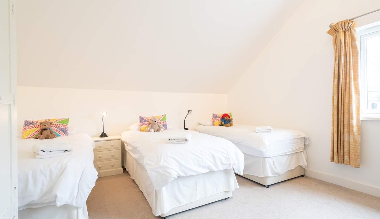 The fourth bedroom offers three single beds... 