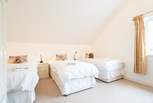 The fourth bedroom offers three single beds... 