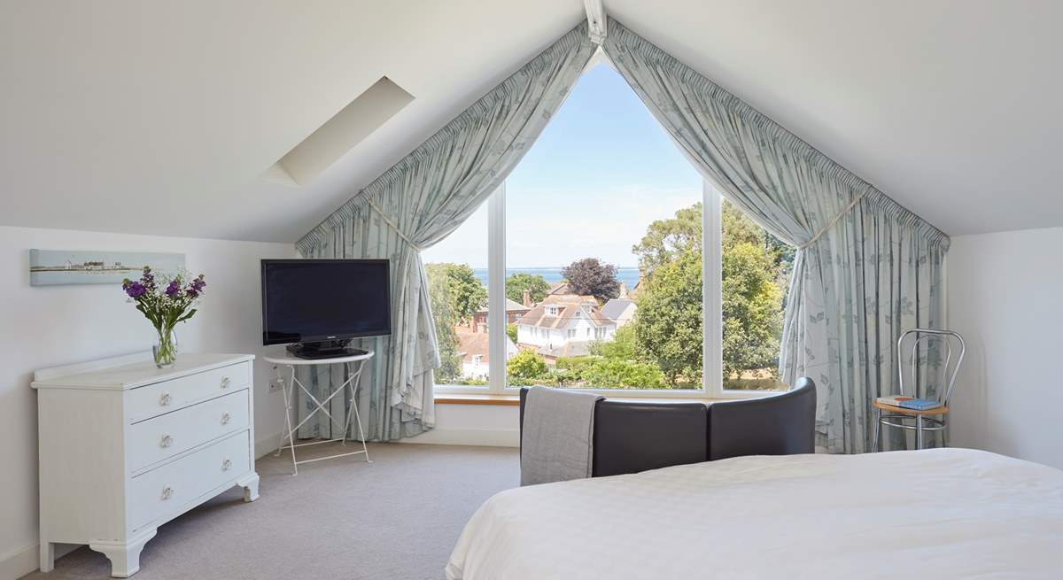 The main bedroom with sea views beyond the village rooftops.