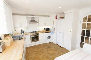 The open plan layout is perfect for entertaining or keeping an eye on young children.