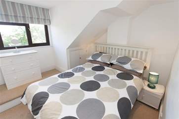 The master bedroom on the first floor boasts lovely views across Seaview.